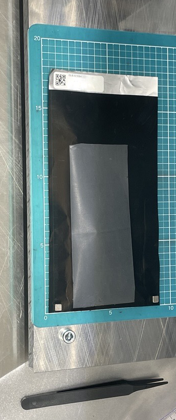 Cathode electrode photographed on cutting mat with tweezers